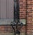 Antique early 20th century ornamental wrought iron arched garden entryway on cast stone blocks. Restoration included.