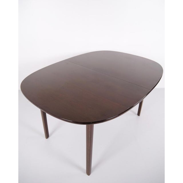 Dining table designed by ole wanscher and produced by poul jeppesen møbelfabrik in denmark during the 1960s. The table...