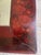 An Aesthetic Movement floral decorated mirror with a Chinese red lacquer base and Asian-inspired floral decoration all...