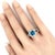 This exquisite ladies ring showcases a dazzling 3.30ct IGI-certified round-cut blue topaz, elegantly set in solid 18k...