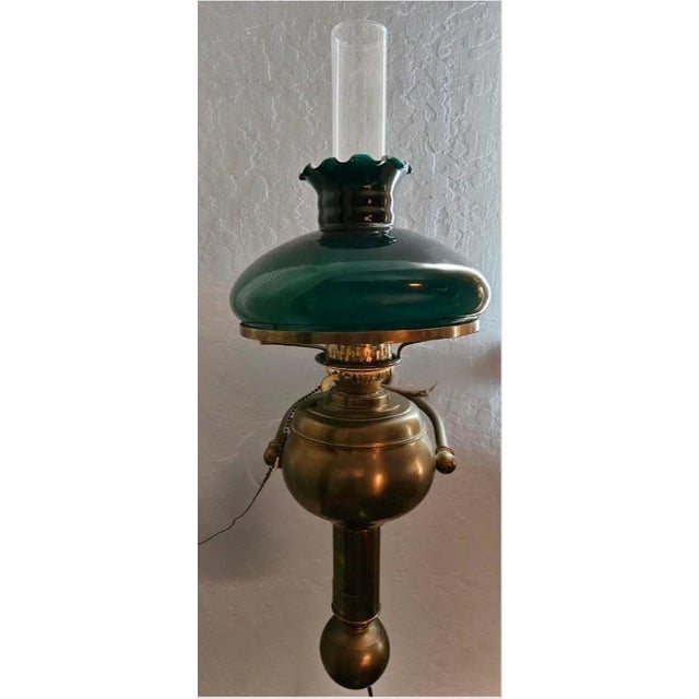 This marvelous antique C. Gray Chandlers Made in Arbroath Scotland brass gimble lamp is topped with a clear chimney and a...