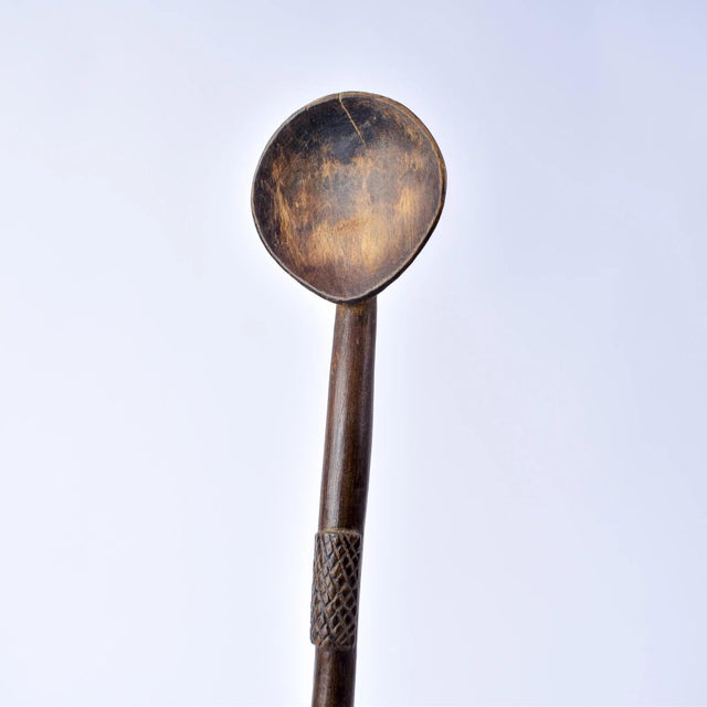 Zulu spoon from the early - mid 20th century. Dark, natural worn patina. Zulu spoons were carved by men only, out of a...