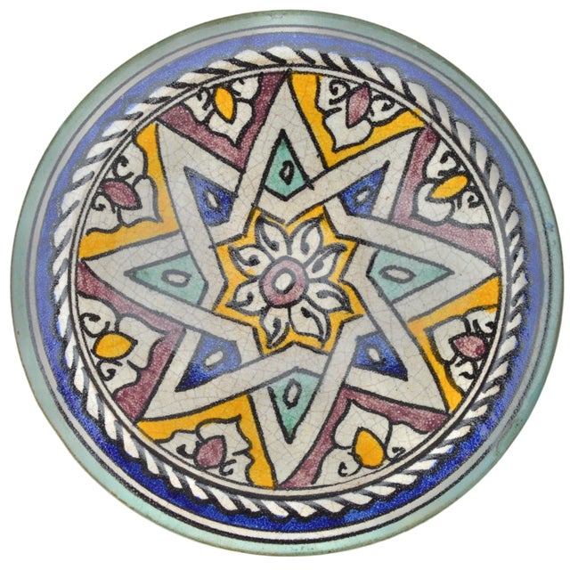 One-of-a-kind antique handcrafted and glazed Moroccan ceramic plate from Fez. Featuring an elaborate hand-painted colorful...