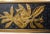 Pair of black & gold wall decorative plates: elongated rectangular format, each decorated with a golden stylized floral...