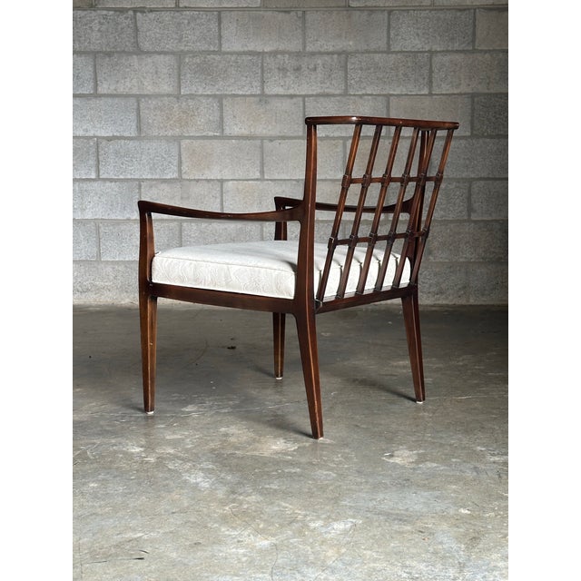 Wonderful accent chair by Baker furniture circa 1950s. Really great spindle back with decorative grid, almost reminiscent...