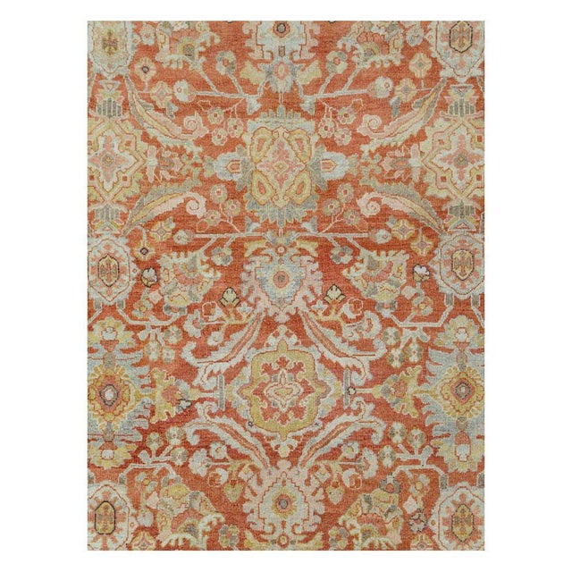 This early 20th-century Persian Mahal room-size carpet presents a richly patterned allover floral composition across a...