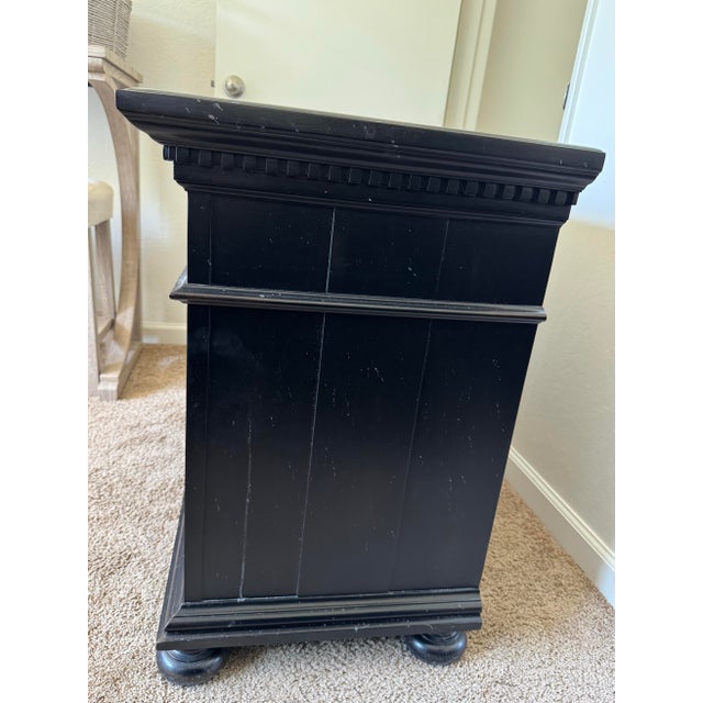 Hand carved open nightstand from Restoration Hardware belonging to the St. James collection.
