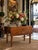 A beautifully patinated antique American country drop-leaf table with a graceful, understated silhouette. The richly aged...