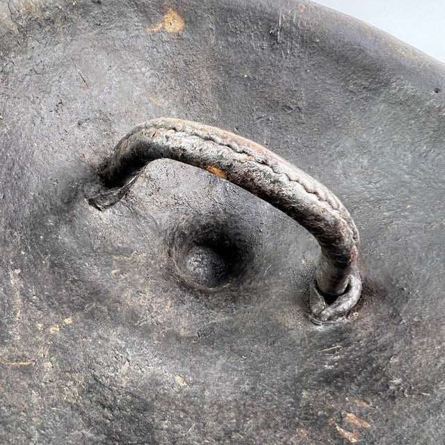 A large, rounded Ethiopian shield made out of leather that could be attributed to various Ethiopian groups or even to...