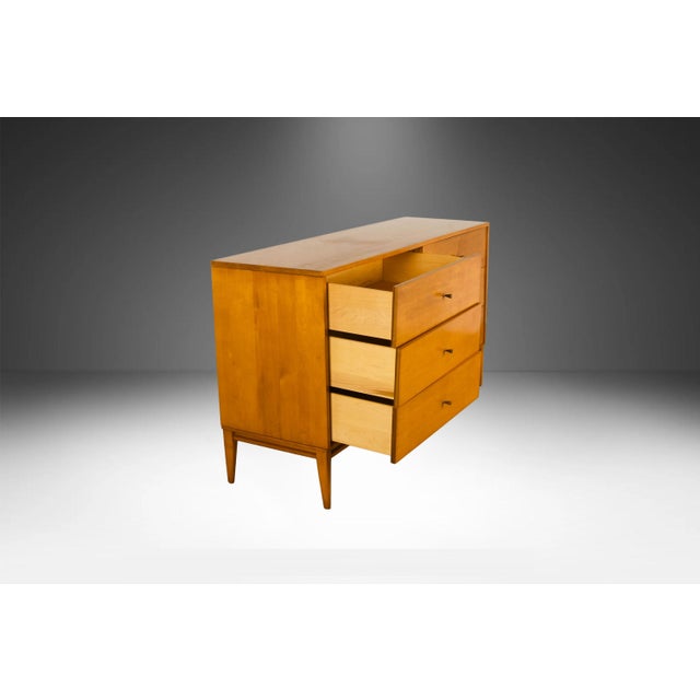 An iconic and early production six-drawer lowboy dresser designed by Paul McCobb for his legendary "Planner Group" series,...