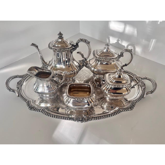 A handsome and complete six-piece tea and coffee service by Gorham in the "Shell & Gadroon" pattern, silverplate. This is...
