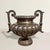 This French cast metal urn dates to the 20th century, a measured homage to the original 19th century Napoléon III models,...