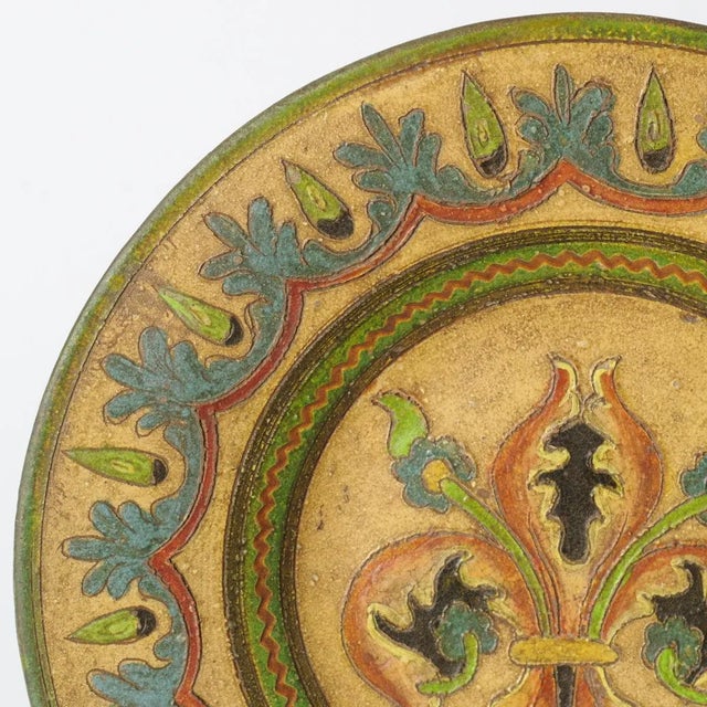 Plate was made of painted terracotta. It was made in Italian renaissance style. This piece has an attribution mark, I am...