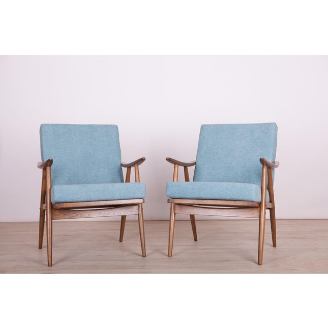 This pair of armchairs were produced by the Czechoslovakian company TON in the 1960s. The beech elements have been cleaned...