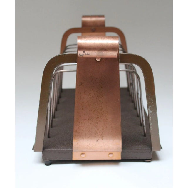 Stylish record rack suitable for stacking LPs or 45s/7" singles (ca. 1960s, USA). Composed of a brown painted plastic...