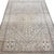 This antique rug features a beautifully stylized central medallion surrounded by an intricate field of minute blue motifs....