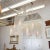 Painted woodcarving chandelier with exquisitely detailed tree branch motif and frosted white glass shades by master...