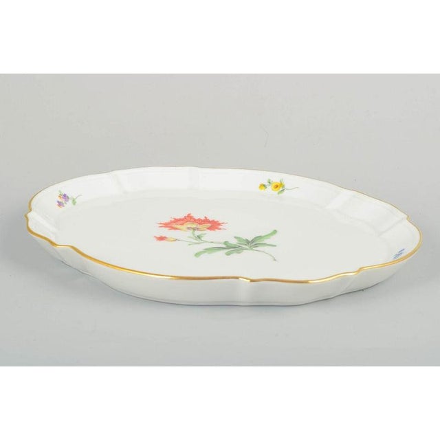 Meissen, Germany Hand-painted tray, early 20th century. Oval Meissen porcelain tray with hand-painted polychrome floral...