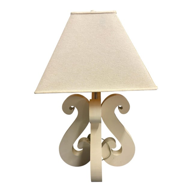 White S shaped table lamps with cream colored linen lamp shades.