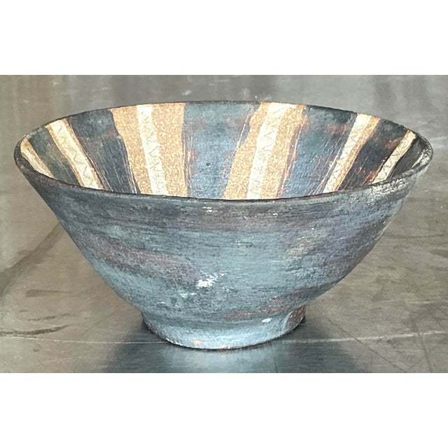This Vintage Boho Striped Studio Pottery Bowl blends earthy tones with artistic flair. Handcrafted with a unique striped...