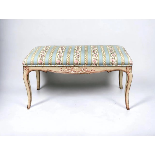 This is a sweet bench! It is an Italian piece with hand painted scrolling shells and vintage striped floral chintz cotton....