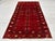 This antique hand-knotted Ersari Turkmen rug features a column of compartmentalized tree panels divided by horizontal...
