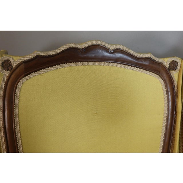 A six-panel screen in molded walnut, carved with small flowers, with two scalloped panels. Late 18th/early 19th century....