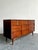 This striking mid-century modern dresser is a masterclass in clean-lined architectural design, artfully blending textural...