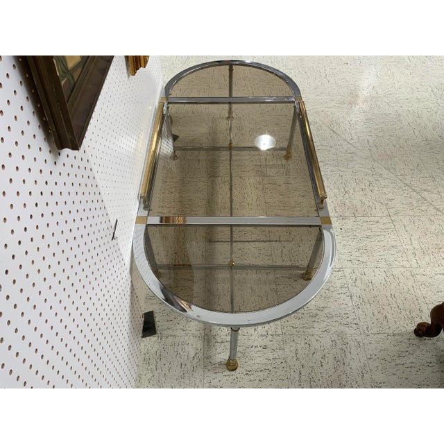 Beautiful vintage coffee table made of chrome and brass polish the table is one of a kind