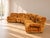 The set retains its original period upholstery in soft ochre/brown velvet, with the sinuous, enveloping lines typical of...