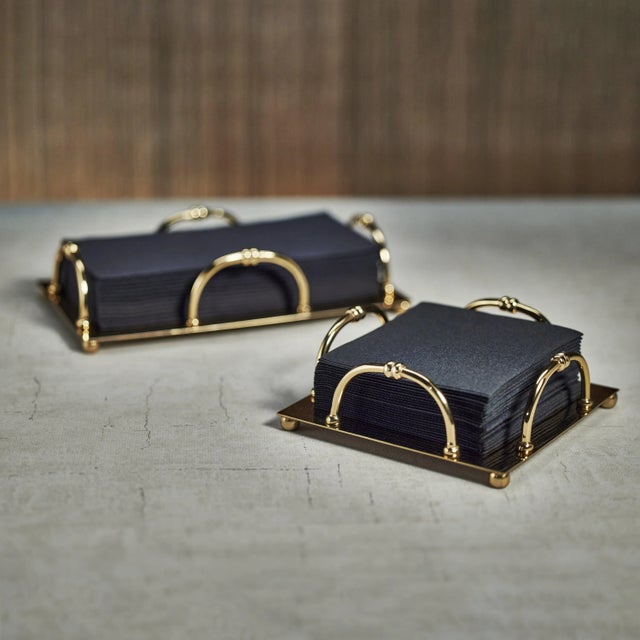 This gold steel dinner napkin holder has a simple and sleek design. Featuring the four D-style rings to help keep the...