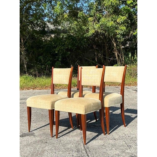 Elevate your dining space with this exquisite set of four vintage French Deco dining chairs. Showcasing an elegant...