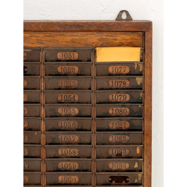 American Vintage Oak Time Card Rack, first half 20th century. 36.25" H x 17.25" W x 2.5" D. Provenance: A Sutton Place...