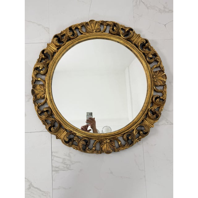 Large circular wall mirror in carved gilded wood, 1940 Diameter 90 cm (mirror only 65 cm). Good condition. Found in a...