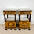Elegant pair of French Empire style nightstands, distinguished by their striking combination of richly figured wood...