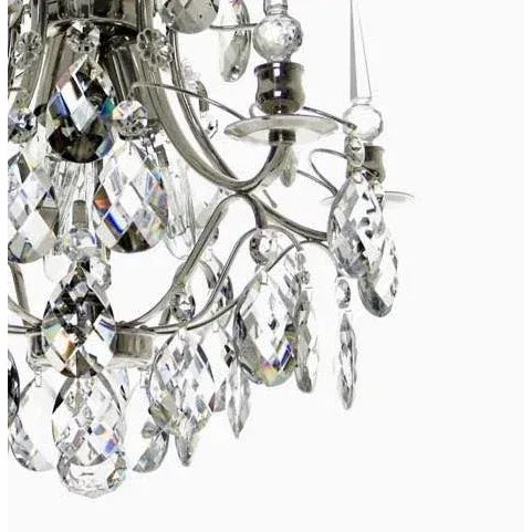 A nickel plated crystal chandelier designed for low ceilings. Baroque style with almond shaped crystals and crystal spikes...