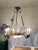 This is a period Art Deco French chandelier. This fixture is imposing with its gilt bronze frame and pink art glass dome...