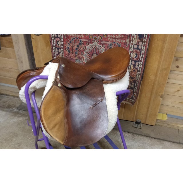 What could be better for equestrian decor than a lovely vintage equestrian saddle. This handsome saddle emotes the image...
