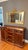 This antique mahogany buffet is a striking piece of furniture that blends functionality with elegance. It features...