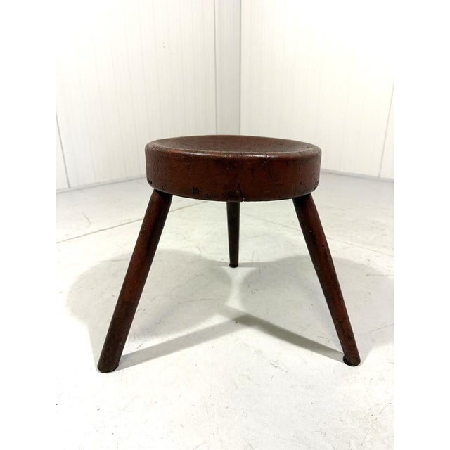 Solid wooden milking stool, France. Very nice shaped round seat made from one pice of wood , three legs, beautiful patina....