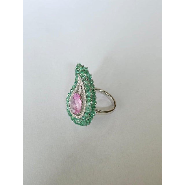A very gorgeous and beautiful, modern style, Emeralds & Pink Sapphire Cocktail Ring set in 18K White Gold & natural...