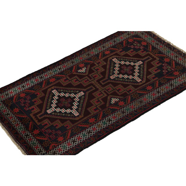 Hand knotted in wool, this 3x5 Baluch rug represents a new line of tribal carpets in the Modern Classics Collection by Rug...