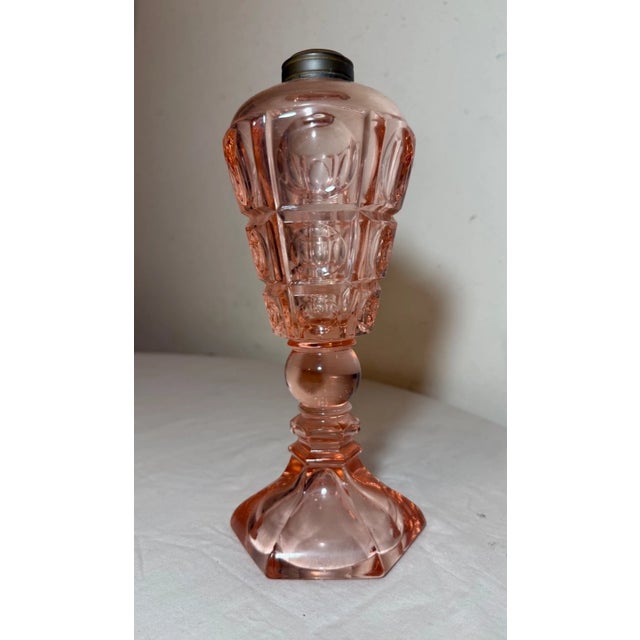 Up for sale is a rare antique 19th century Westmoreland pink glass whale table oil lamp. This original oil lamp is made of...