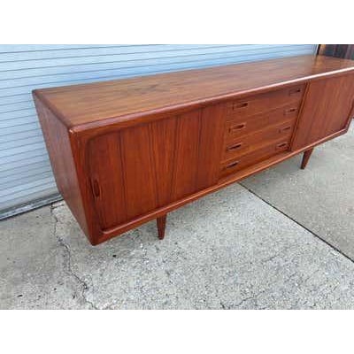 H.P. Hansen Teak Credenza with sliding doors and center drawers. Beautiful shape with top newly refinished. 86" long with...