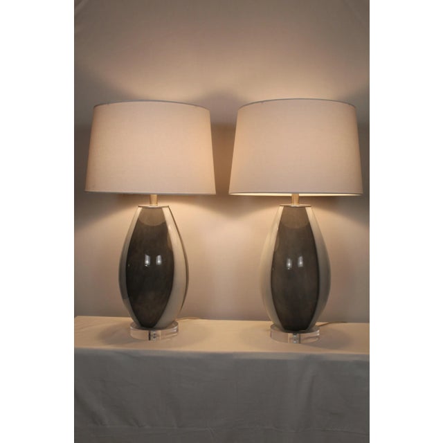 Beautiful pair of Organic modern Murano glass table lamps. Hand blown dove gray and white accounts for variations in the...