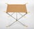 Quite elegant pair of polished steel and brass X-from stools with taupe leather seats. A very successful interpretation of...