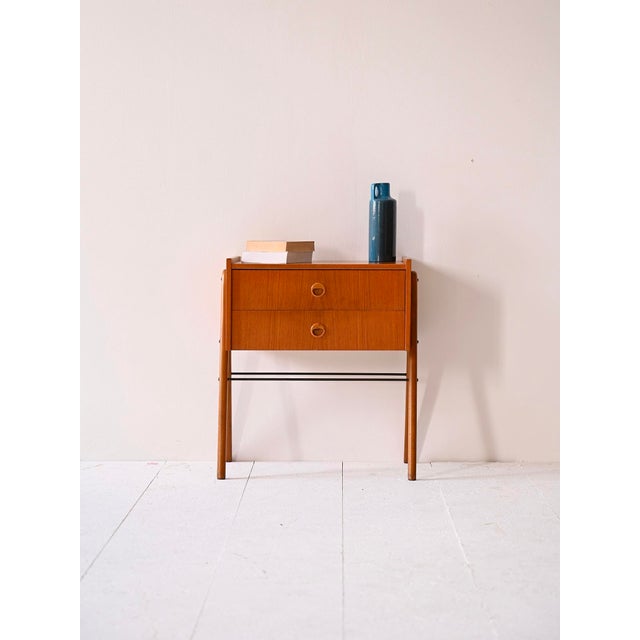 Nordic style bedside table with drawers. A piece of timeless beauty that reflects mid-century style. Consisting of two...