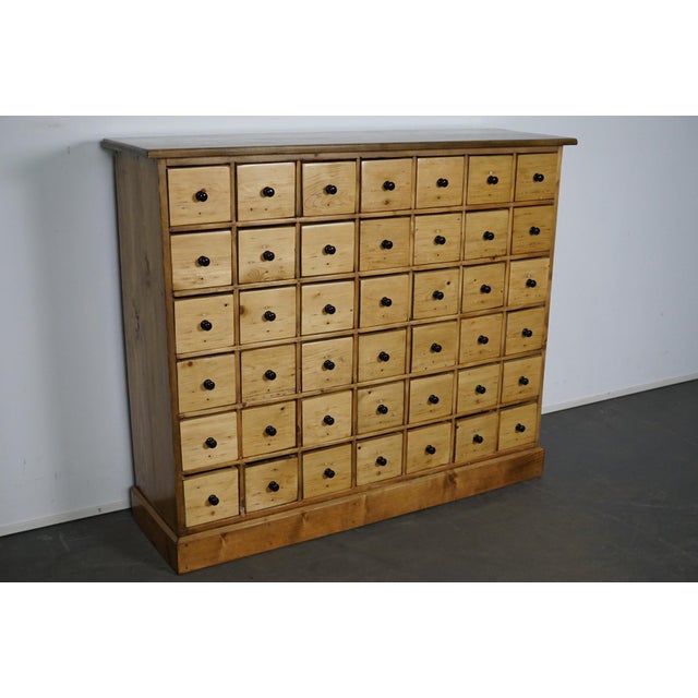 This apothecary cabinet of drawers was designed, circa 1950s in the Netherlands. The piece is made from pine and features...