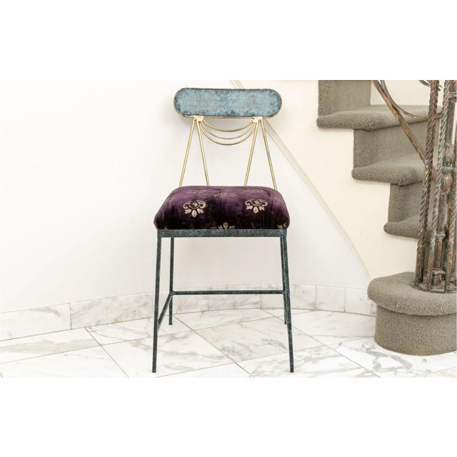 Mid-Century Italian bronze, brass and iron accent chair. Beautifully detailed with slanted brass back and bronze oval...