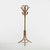 An elegant freestanding coat rack in rattan and woven wicker, embodying the natural and decorative aesthetic that defined...